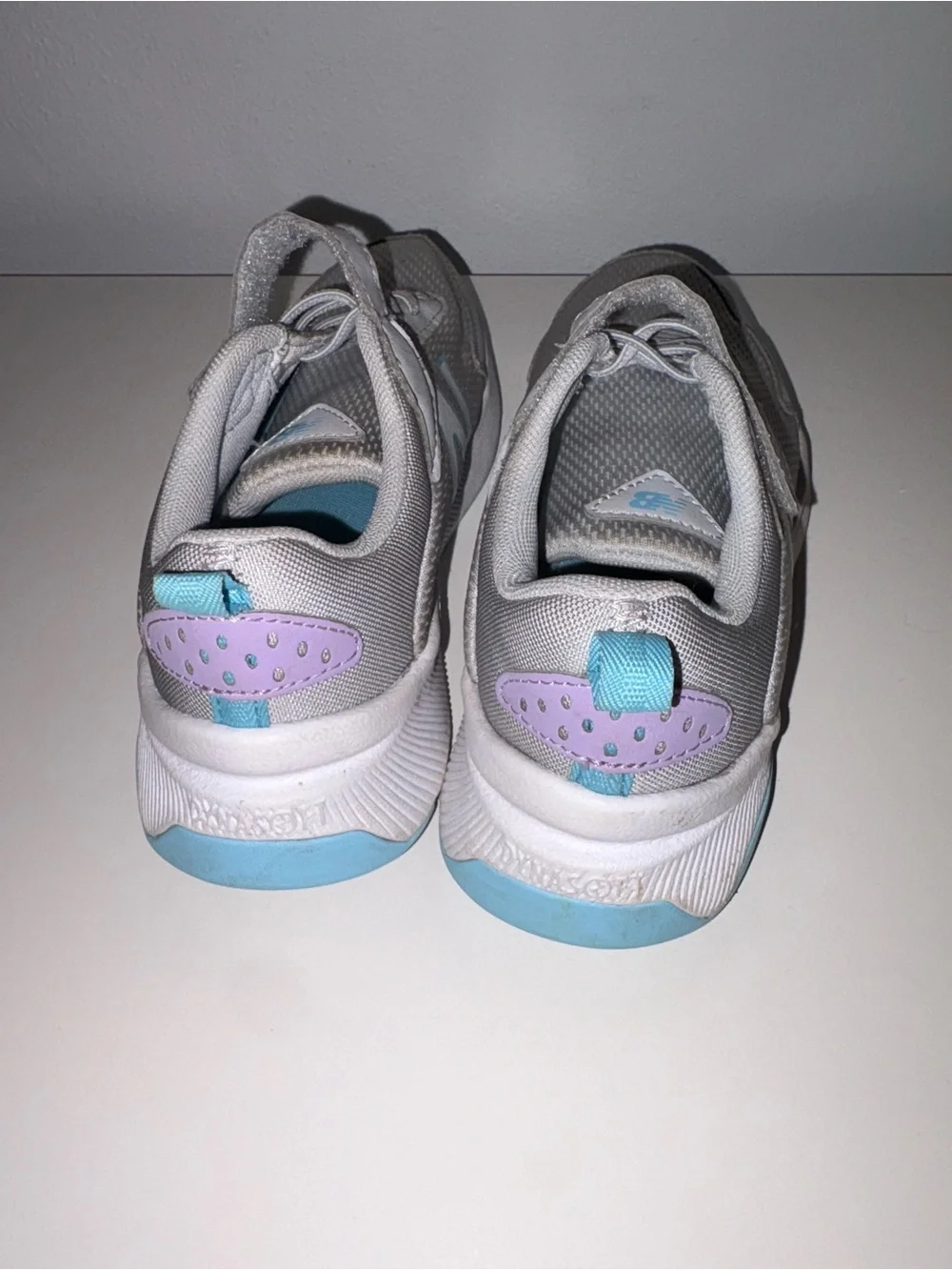 New Balance Kids Gray Sneakers with Purple and Blue Accents